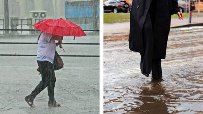 Fotografía de dos peatones bajo la lluvia, uno con paraguas y el otro en un charco